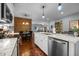 Contemporary kitchen with stainless-steel dishwasher, white cabinets and granite counters at 928 Arrowhead Ln, Mebane, NC 27302
