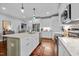 Bright kitchen with white cabinetry, granite countertops and stainless-steel appliances at 928 Arrowhead Ln, Mebane, NC 27302