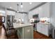 Updated kitchen featuring stainless steel appliances and center island with granite countertops at 928 Arrowhead Ln, Mebane, NC 27302