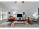 Comfortable living room with hardwood floors, cozy seating, and a large window at 928 Arrowhead Ln, Mebane, NC 27302