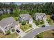 Aerial showing a beautiful home, manicured lawns, and serene neighborhood surrounded by lush trees at 948 Uprock Dr, Cary, NC 27519