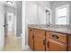 Bathroom featuring granite countertops, wooden cabinets, and tile flooring at 948 Uprock Dr, Cary, NC 27519