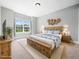 Well appointed bedroom features a large window, carpet, and earth tone color scheme at 948 Uprock Dr, Cary, NC 27519