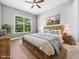 Cozy bedroom with a comfortable bed, soft lighting, and a view of the outdoors, creating a relaxing retreat at 948 Uprock Dr, Cary, NC 27519