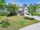 Beautiful home with a manicured lawn, mature trees, and inviting curb appeal at 948 Uprock Dr, Cary, NC 27519