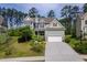 Charming two-story home with a well-manicured lawn and attached two-car garage at 948 Uprock Dr, Cary, NC 27519