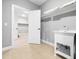 Functional laundry room with sink, tile floor, and closet at 948 Uprock Dr, Cary, NC 27519