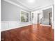 Open-concept living room with hardwood floors and plenty of space for entertaining at 948 Uprock Dr, Cary, NC 27519