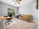 Functional office with a desk, comfortable seating, and natural light, perfect for a productive workspace at 948 Uprock Dr, Cary, NC 27519