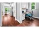 Office space features a built-in desk, granite counters, white cabinets and hardwood flooring at 948 Uprock Dr, Cary, NC 27519