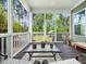 Charming screened porch overlooking backyard and green scenery at 948 Uprock Dr, Cary, NC 27519