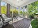 Relaxing screened porch with comfortable seating and wooded views at 948 Uprock Dr, Cary, NC 27519