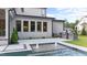 Backyard features a built-in grill and a refreshing pool with a fountain feature for outdoor enjoyment at 949 Harrison Ridge Rd, Wake Forest, NC 27587