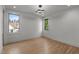 Empty bedroom with hardwood floors and bright windows offering natural light at 949 Harrison Ridge Rd, Wake Forest, NC 27587