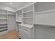 Spacious walk-in closet with custom shelving and storage solutions at 949 Harrison Ridge Rd, Wake Forest, NC 27587