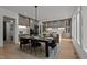 Dining area with stylish lighting, and seamless flow to the kitchen featuring stainless steel appliances at 949 Harrison Ridge Rd, Wake Forest, NC 27587