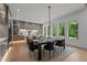 Open dining area with an elegant chandelier, modern furnishings, and seamless flow to the kitchen at 949 Harrison Ridge Rd, Wake Forest, NC 27587