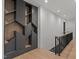 Hallway with custom built-in shelving and modern lighting fixtures at 949 Harrison Ridge Rd, Wake Forest, NC 27587