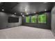 Spacious living room with recessed lighting, multiple windows, and a modern media setup for entertainment at 949 Harrison Ridge Rd, Wake Forest, NC 27587