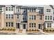 Charming townhomes featuring brick facades and complementary siding in a modern color palette at 987 Parkstone Towne Blvd, Knightdale, NC 27545