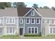New construction home with light blue siding and a welcoming front entrance at Lot 5 Cooper St, Sanford, NC 27330