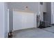Attached one-car garage with a white door, offering convenience and security at Lot 5 Cooper St, Sanford, NC 27330