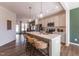 Modern kitchen with an island, pendant lighting, stainless appliances, and bar stool seating at Lot 5 Cooper St, Sanford, NC 27330