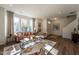 Bright living room features a leather sofa, large windows, and wood-look flooring at Lot 5 Cooper St, Sanford, NC 27330
