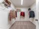 Carpeted walk-in closet has wire shelving and ample space for storage at Lot 6 Cooper St, Sanford, NC 27330