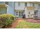 Backyard patio with grill and seating with partial grass area and newly mulched garden at 10 Grove Park Rd, Durham, NC 27705