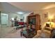Cozy living room with bar access, featuring a TV, cabinet, comfortable seating and neutral decor at 10 Grove Park Rd, Durham, NC 27705