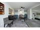 Dining area with a modern fireplace, gray tile floors, and view of living space at 1004 Greenwich St, Raleigh, NC 27610