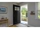 Inviting entryway with natural light, wood floors, and convenient storage at 1004 Greenwich St, Raleigh, NC 27610