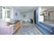 Eclectic living room boasts retro decor and an open design to the kitchen and office at 1004 Greenwich St, Raleigh, NC 27610