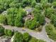 This home has mature trees, lush landscaping, and is located on a corner lot in a sidewalk community at 101 Abbotsford Ct, Durham, NC 27712