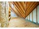 Spacious attic with exposed beams, insulation and plywood flooring at 101 Abbotsford Ct, Durham, NC 27712
