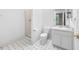 Bathroom featuring a glass door shower, vanity with storage, and tile flooring at 101 Abbotsford Ct, Durham, NC 27712