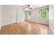 Bedroom with hardwood floors and windows offering natural light at 101 Abbotsford Ct, Durham, NC 27712