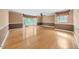 Spacious bedroom featuring hardwood floors, natural light, and decorative window treatments at 101 Abbotsford Ct, Durham, NC 27712