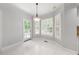 Breakfast nook features tiled floors, large windows with views and exterior access at 101 Abbotsford Ct, Durham, NC 27712
