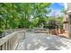 Expansive deck with railing, ideal for outdoor entertaining and relaxing in a serene setting at 101 Abbotsford Ct, Durham, NC 27712