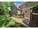 Exterior showcasing the home's brick and siding details, complemented by lush landscaping at 101 Abbotsford Ct, Durham, NC 27712