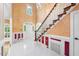 Inviting foyer showcases a staircase with decorative trim and an arched doorway at 101 Abbotsford Ct, Durham, NC 27712