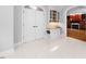 Spacious foyer with tiled floor, arched entryway and built-in hutch with granite counter at 101 Abbotsford Ct, Durham, NC 27712