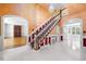 Entry foyer features decorative trim, staircase with stained wood accents and arched doorways at 101 Abbotsford Ct, Durham, NC 27712