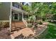 Charming two-story home with a covered front porch and brick steps leading up to the front entrance at 101 Abbotsford Ct, Durham, NC 27712