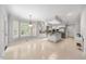 Open-concept kitchen with tiled floors, white cabinets and a central island at 101 Abbotsford Ct, Durham, NC 27712