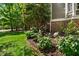 Well maintained landscaping with blooming flowers and lush greenery around the house at 101 Abbotsford Ct, Durham, NC 27712