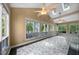 Bright sun room with skylights, multiple windows, and marble flooring perfect for relaxation at 101 Abbotsford Ct, Durham, NC 27712