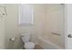 Bathroom with a combination shower and tub, toilet and window at 101 Pickett Ln, Cary, NC 27511